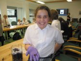 RGU pupil enjoying making her pet composter.