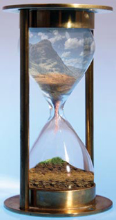 Image showing Hour glass with soil pouring through it