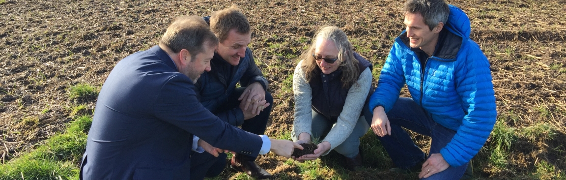 Colin Campbell, Matt Gorman, Helaina Black and Stewart Arbuckle look at soil