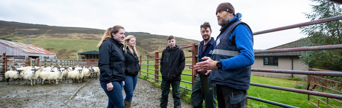 Donald Barrie (r), Glensaugh farm manager, speaks to SRUC students