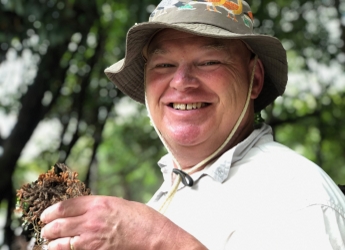Dr Euan James holding a nodule sample collected in the Amazon region