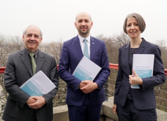 The report was launched by Migration Minister Ben Macpherson (centre)