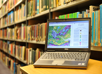 Photograph of a laptop computer in a library