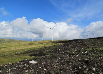 Photograph of a wind turbine and peat bog