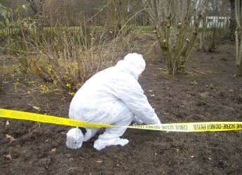 Photograph of soil forensic samples being collected (courtesy Lorna Dawson)