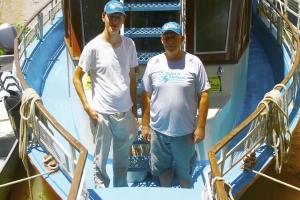 Christopher with Douglas Trent of Bichos do Pantanal after a successful research trip on the Paraguay River in the Northern Pantanal. Credit: Christopher Schulz, 2014