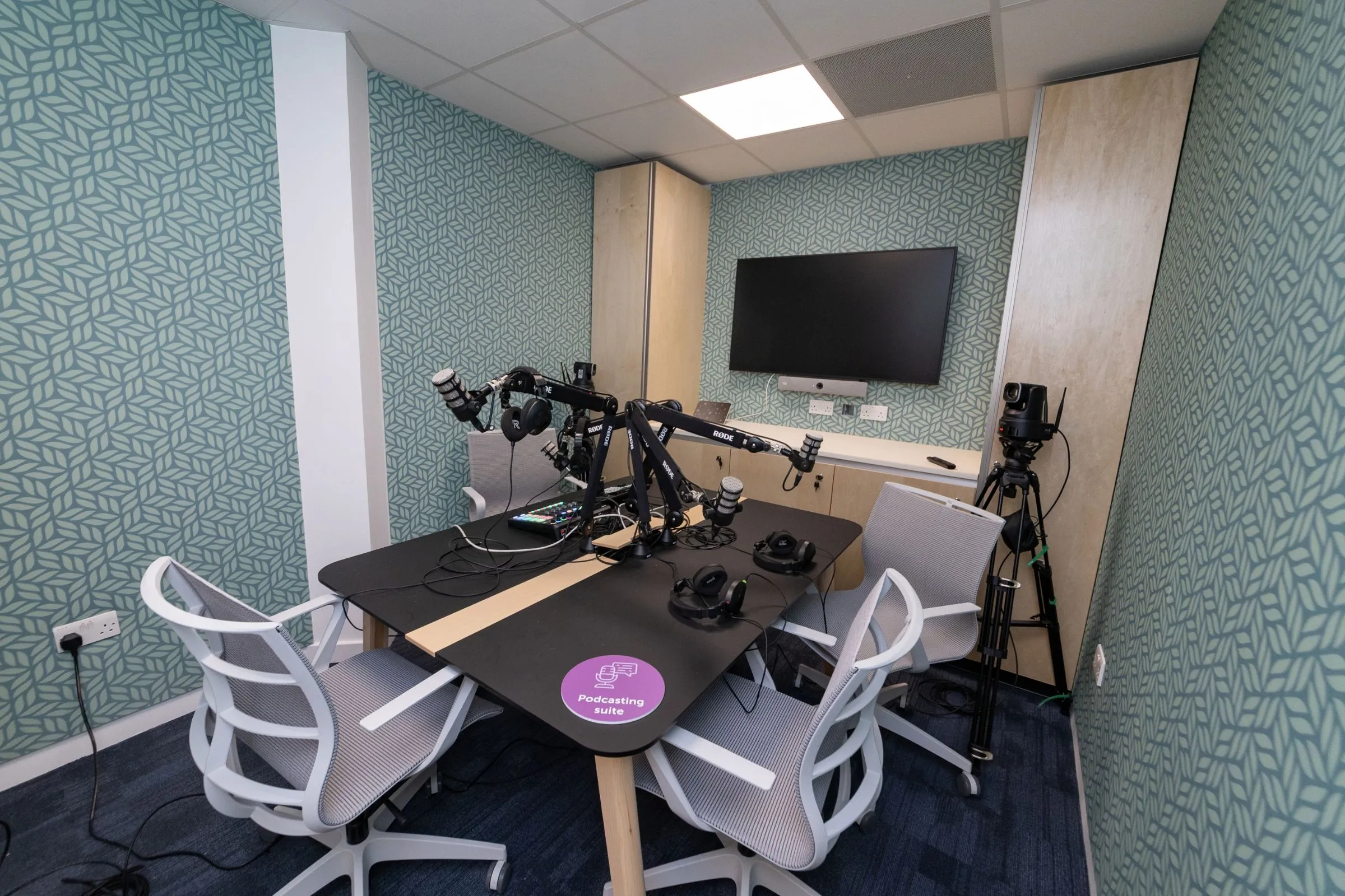 Podcast Suite at the Hutton Hub, a recording studio with microphones and seating for up to four people